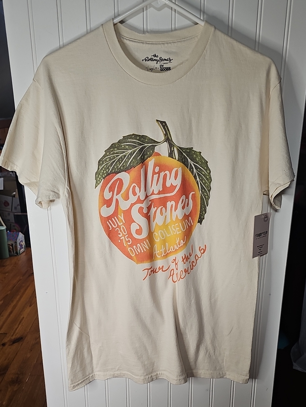 the Rolling Stones Cream Tee with Peach Graphic and Green Leaves Oversized